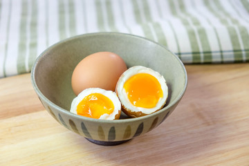 half medium-boiled eggs in Japanese Bowl