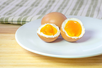 half medium-boiled eggs on white dish