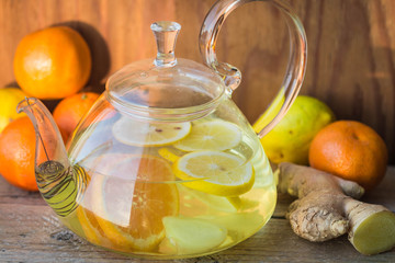 Hot warming drink - tea with tangerine, lemon, ginger and honey
