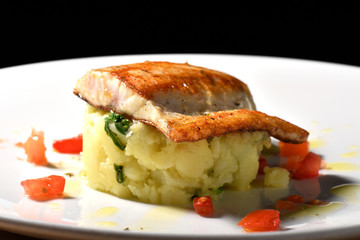 Tasty healthy fish fillet with potato and vegetables