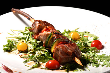 Fresh Tuna skewers grilled and served on salad