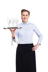 Woman in waiter uniform holding tray with glasses, smiling, isol