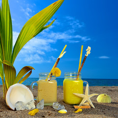 Two fresh juices on beach