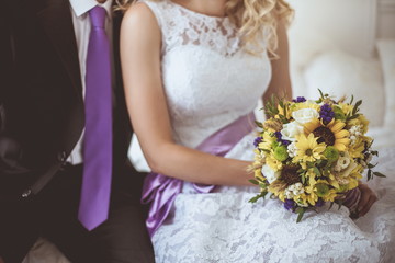 Obraz na płótnie Canvas Beautiful wedding bouquet in hands of the bride