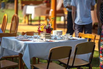 decorated table with flowers in the garden