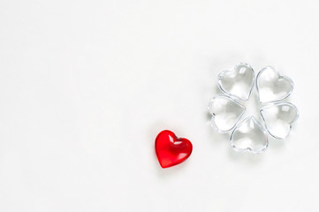 Glass hearts on white background