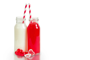 Two retro bottles with striped straws