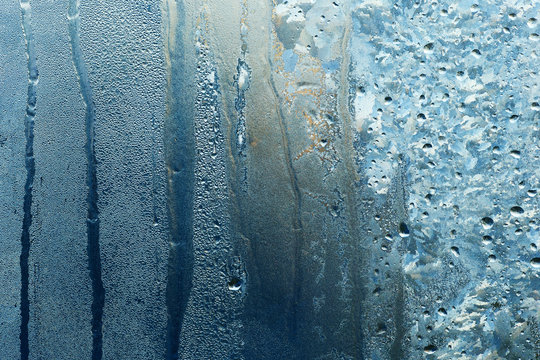 Frozen Water Drops On Glass With Streaks