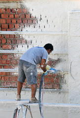 Plaster facade with mortar injected under pressure