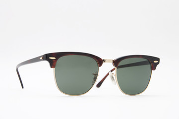 Retro brown sunglasses side view . Isolated on a white backgroun