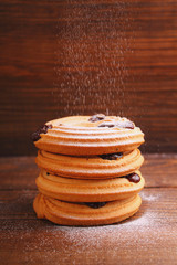 cookies with powdered sugar on a dark background
