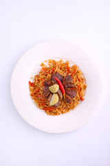 Uzbek pilaf with lamb with red pepper and garlic