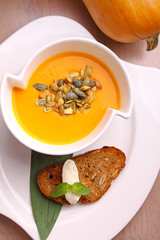 pumpkin soup in a white plate