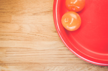 ripe plums red dish  - fresh fruits backgrounds