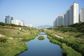 Apartment buildings with stream