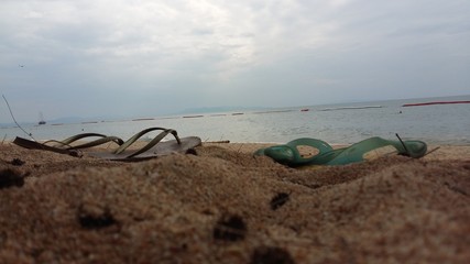 Fototapeta na wymiar Flip flop on the beach