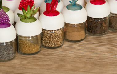 Spices in bottles  on the wooden table