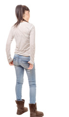 Fototapeta premium pretty young woman standing on white background, back view