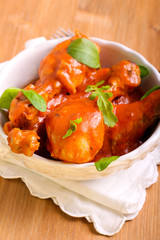 Chicken drumsticks in tomato sauce