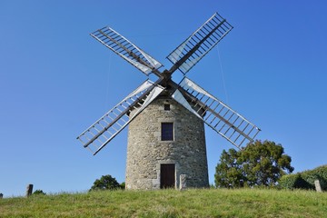 Fototapeta na wymiar A traditional windmill in Lancieux, Brittany (France) 