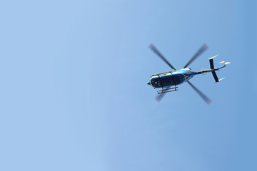 Fototapeta na wymiar Emergency Rescue Transport Helicopter Flying in Blue Sky