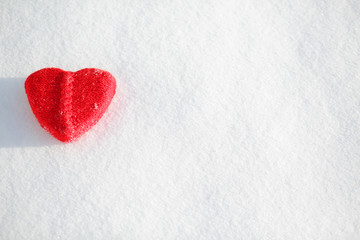 red heart shape on a snowy background