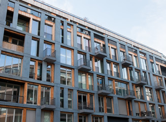 Fototapeta na wymiar Modern Apartment Building with Small Balconies