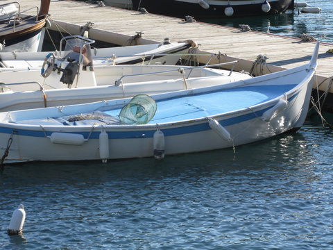 Little fishing boats anchored in a village port of Golfo Dei Poeti, Province of La Spezia, Italy