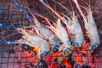 Grilled shrimps on the flaming grill.