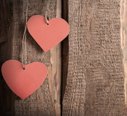 vintage red hearts on wooden background