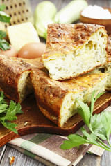 Zucchini pie with cheese and herbs