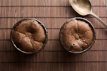  two coulant cakes on brown bamboo