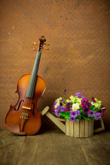 Fototapeta na wymiar Vintage composition with violin and flower