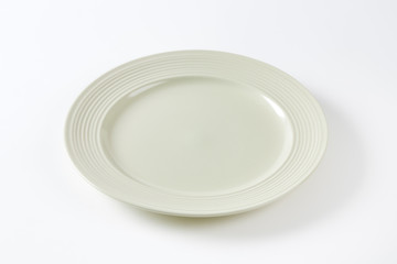 Bone white dinner plate with wide rim