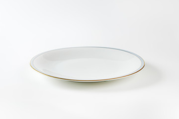 White plate with blue and gold band