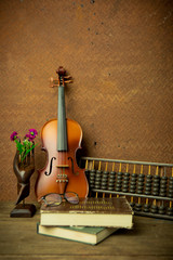 violin in vintage style on old steel  background