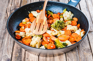 Fried vegetable mix pan on wooden background