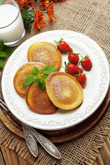 Fototapeta na wymiar Homemade pancake with sugar powder