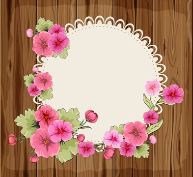 Beautiful flowers on a round napkin and wooden background