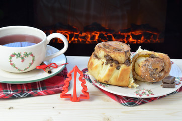 Cinnamon rolls and tea by the fireplace