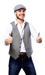 Young handsome man posing and giving a thumb up isolated on white background