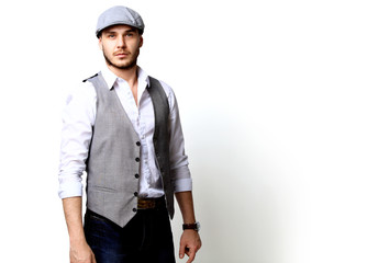 Happy young man. Portrait of handsome young man in casual shirt  smiling while standing against white background