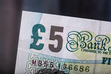 Obraz premium Pound currency, money, banknote. English currency. UK banknotes of different values stacked on each other.