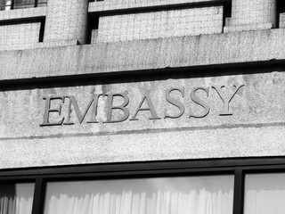 Embassy sign on a modern building entrance