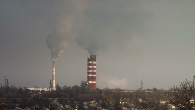 Smoke from Pipes of the Industrial Plant in the City.