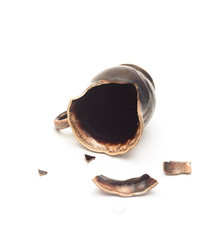 broken  ceramic cup on a white background closeup