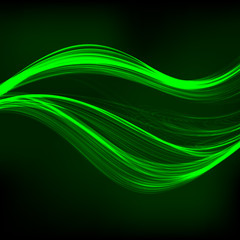 Abstract green waves on the dark background.