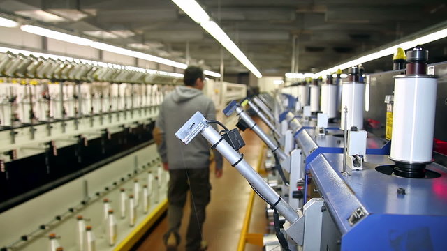 Textile Production Manager Working Inside Factory
