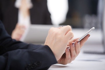 mobile phone in the women's hands