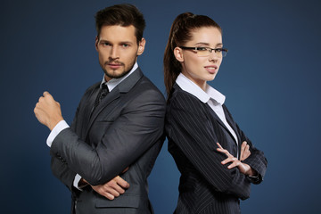 Business couple on blue background